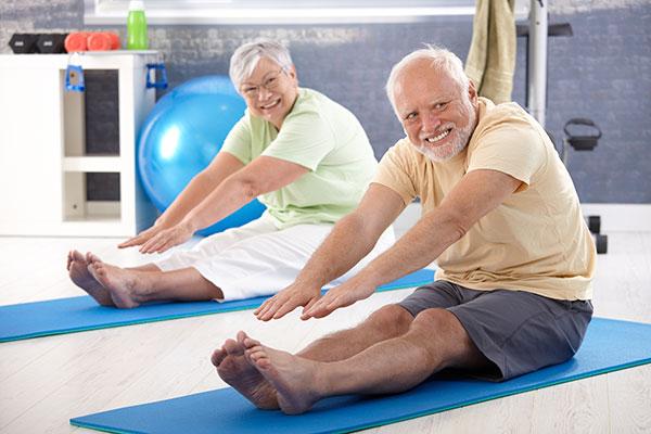 Medicare Image - Older couple at Yoga class