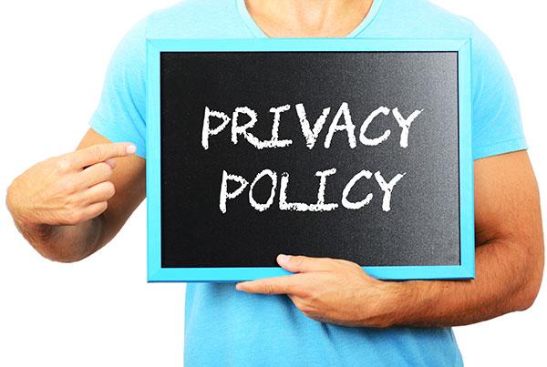 Privacy policy image - Man holding privacy policy sign